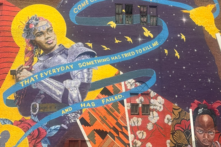 A mural in Newark with the line 'That everyday something has tried to kill me and has failed'
